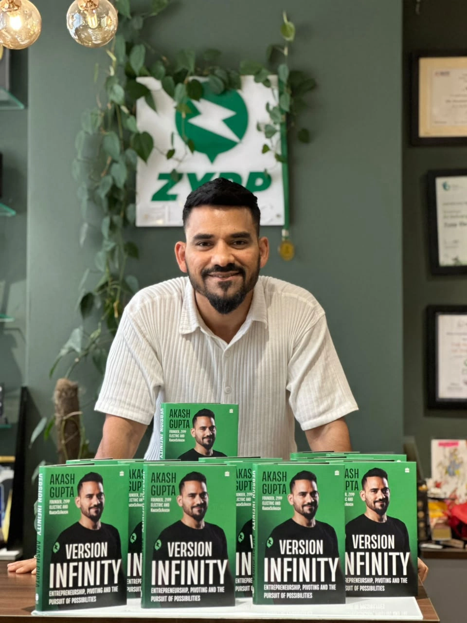 Akash Gupta with copies of Version Infinity